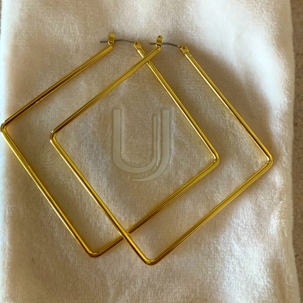 Uncommon James girl boss gold earrings.